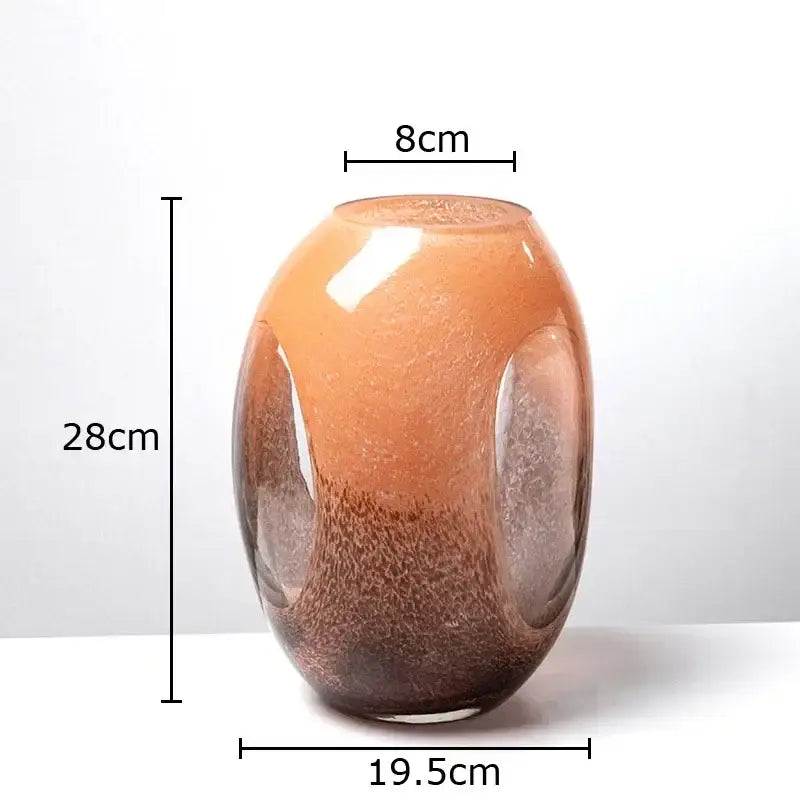 A sleek 28cm decorbites dual color glass vase with amber to brown gradient and frosted oval cutouts for living room decor