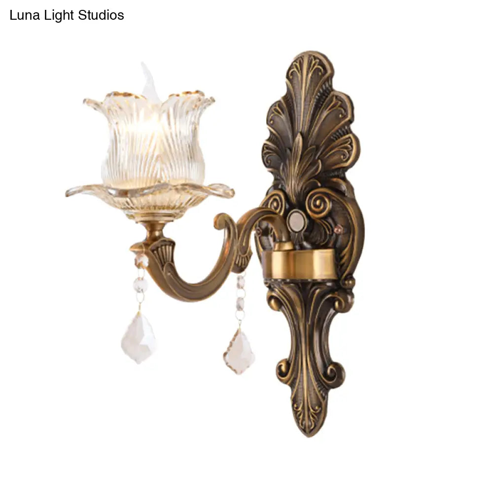 Antique Brass Wall Lamp: Single Wall Mounted Bedside Light with Flower Shade & Clear Prismatic Glass