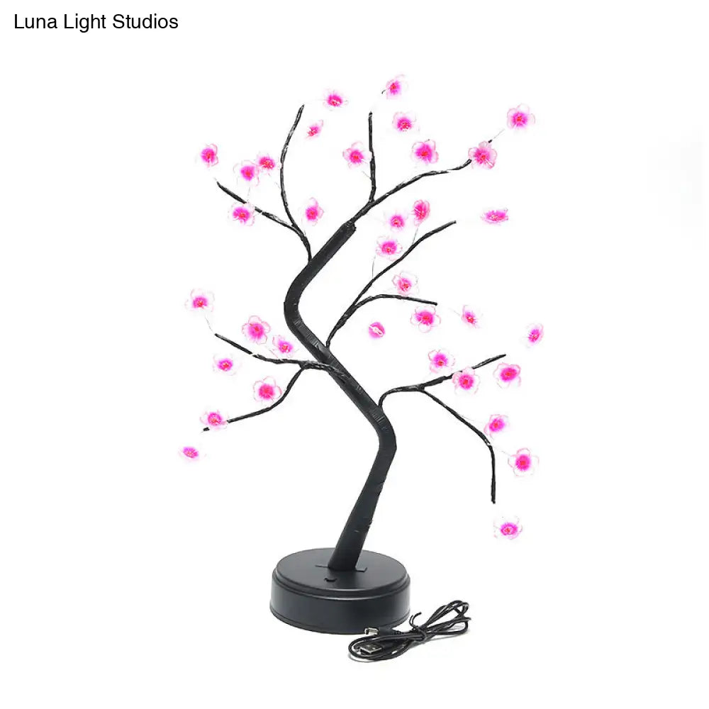 Lámpara de mesa LED negra con diseño floral: Iluminación moderna para mesita de noche o dormitorio