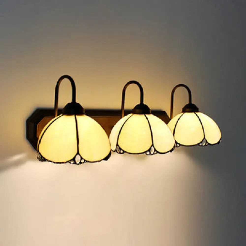 Aplique de pared Tiffany Petal de cristal azul y beige con 3 luces, para dormitorio, en color negro.