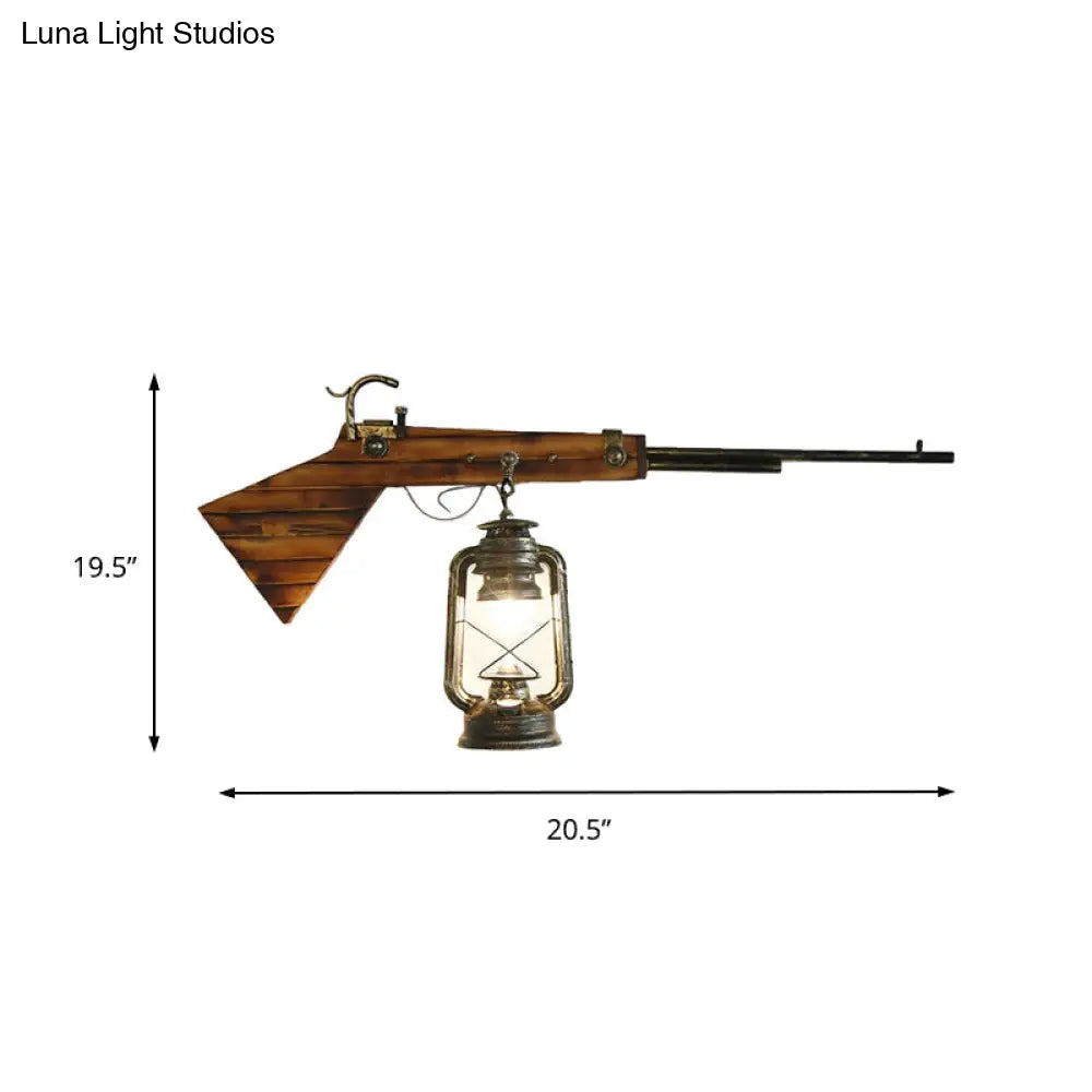 Farol de pared Coastal Bronze con cristal transparente y decoración de pistola