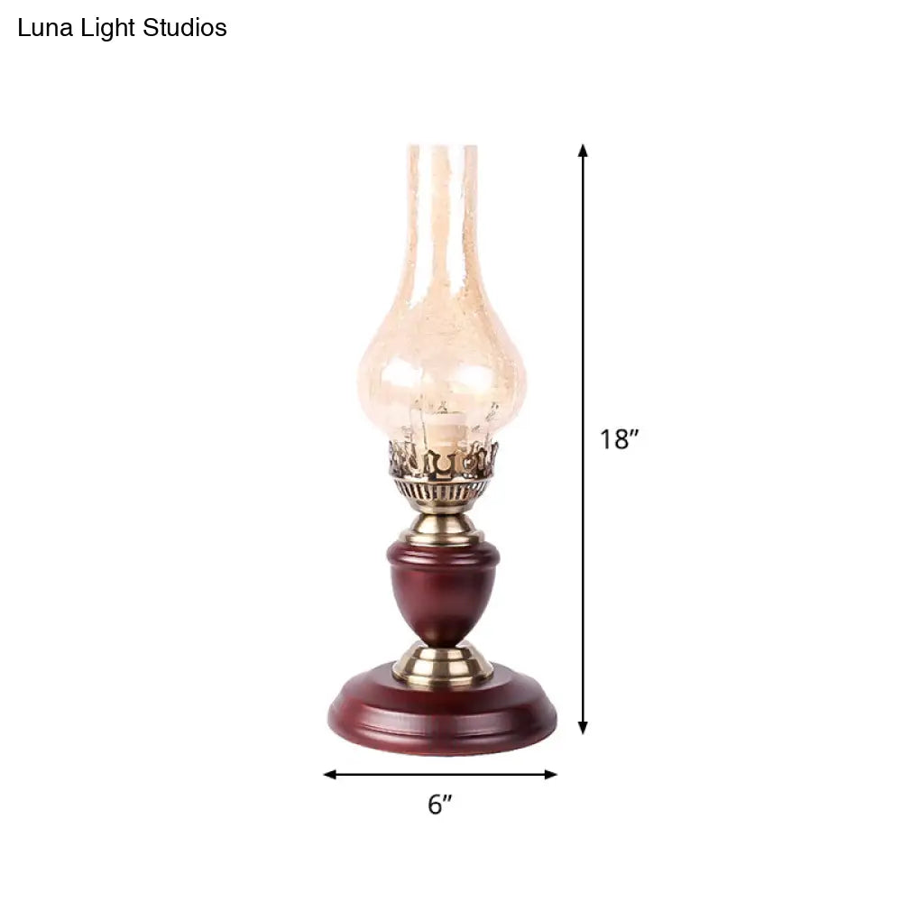 Lámpara de mesa Coastal Vase: Base de madera con luz nocturna de cristal craquelado color marrón rojizo.