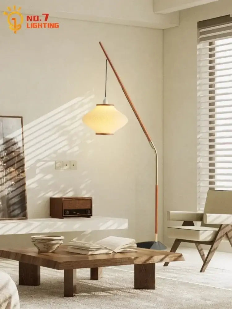 A sleek cream wind acrylic amber glass floor lamp with a polished metal frame for living room decorbites cream wind