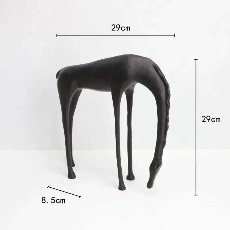 Black matte-finished giraffe-shaped side table with slender legs and sleek minimalist design for decorbites abstract horse iron decor