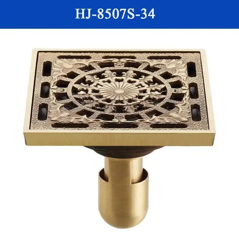 Decorbites antique brass shower drain cover with intricate floral and geometric patterns in brass shower drain design