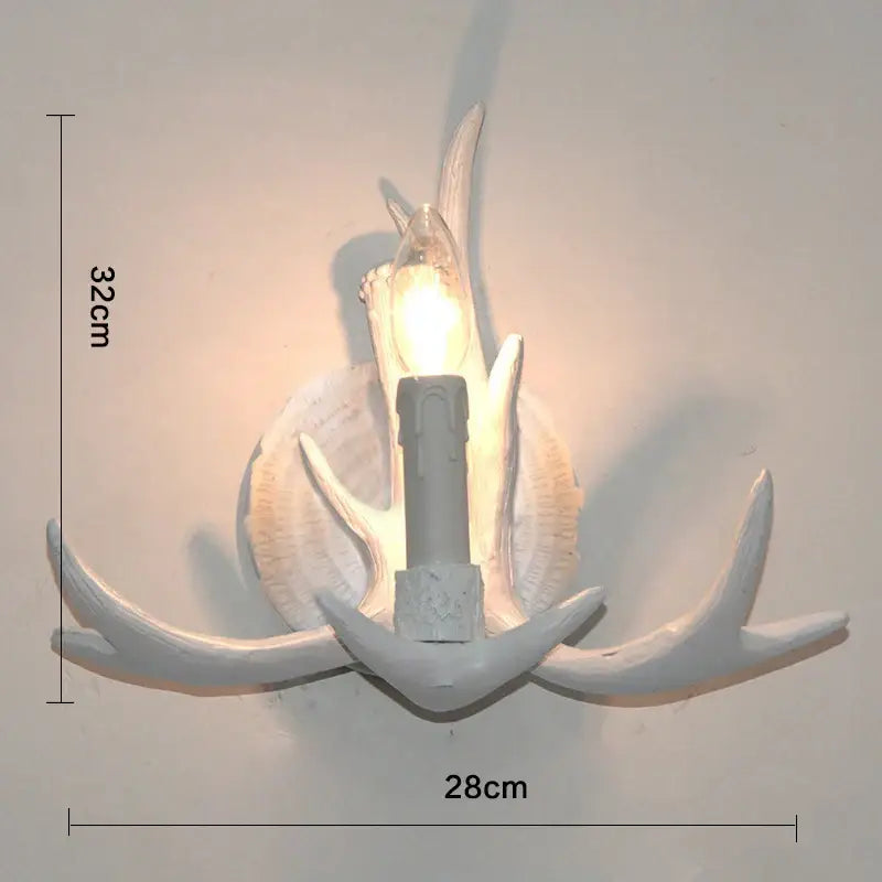White ceramic wall lamp with antler and shell motifs by DecorBites antler resin for living room and hotel use