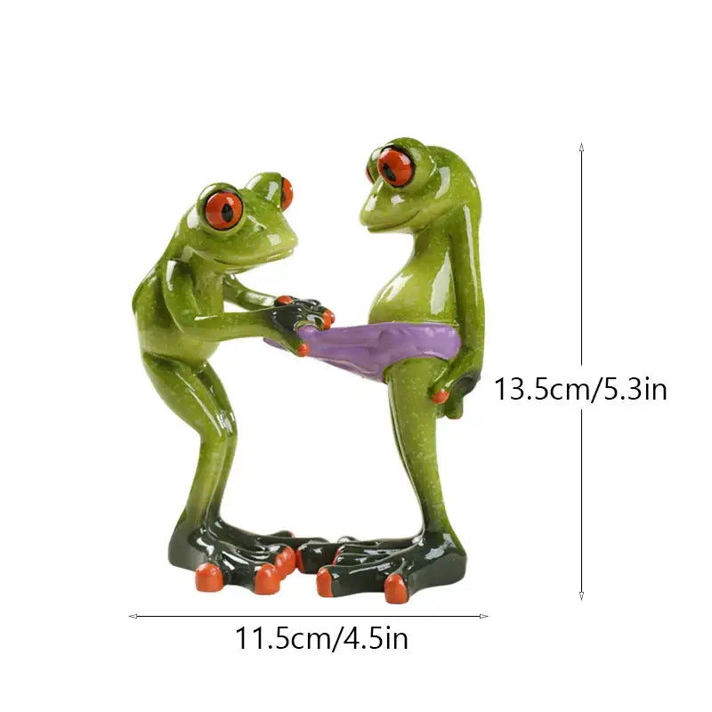 Green resin frog figurine with red eyes and orange toes holding a purple belt from decorbites funny frog couple decor
