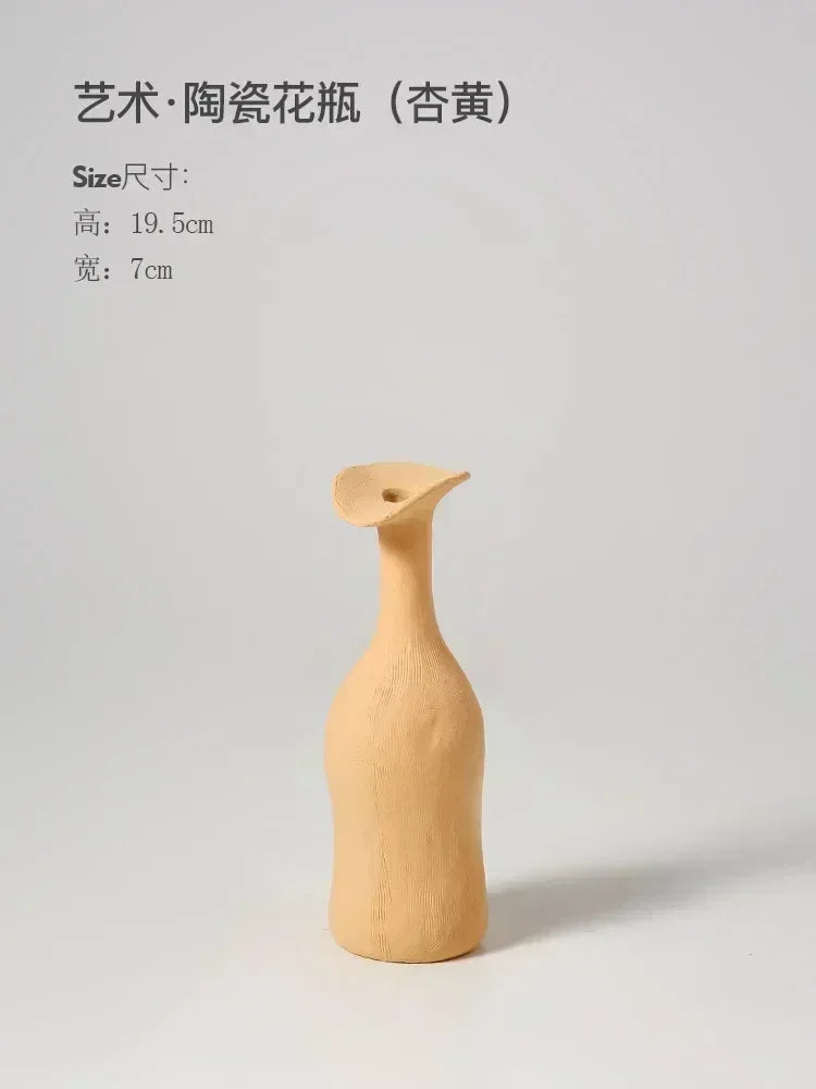 DecorBites™ handmade beige ceramic flower vase with a slender curved neck and flared opening for luxury home decor