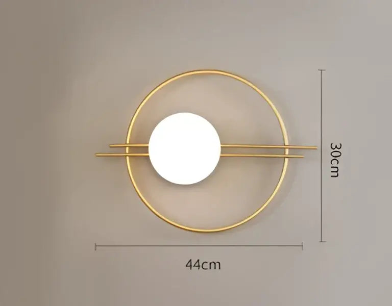 Gold-toned decorbites led g9 wall sconce with central illuminated circle and two horizontal bars for modern minimalist decor