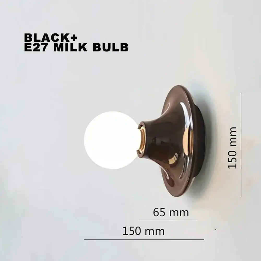 Black e27 milk bulb with glossy finish and gold-toned base in decorbites led macaron wall lamp for living room lighting
