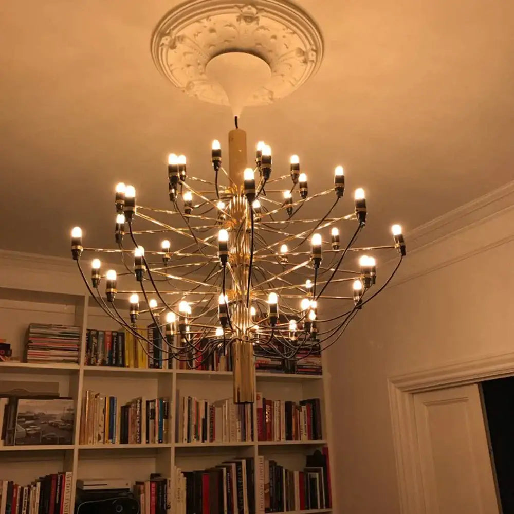 A golden multi-armed decorbites dimmable vintage led filament chandelier with amber glass bulbs and black cords