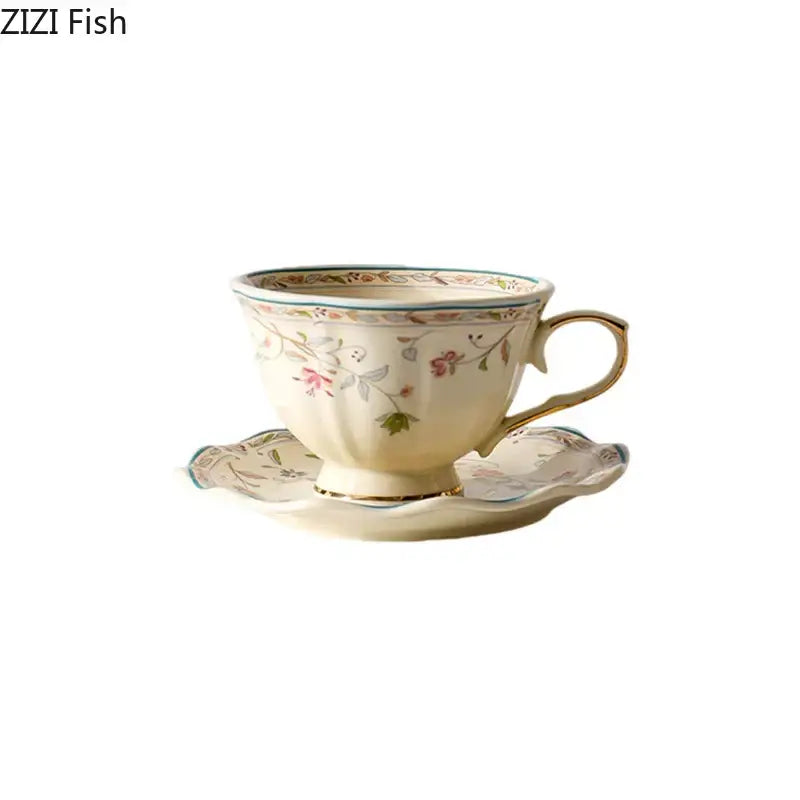 Cream-colored elegant floral ceramic cup and saucer set with pink green floral patterns and gold-trimmed porcelain design