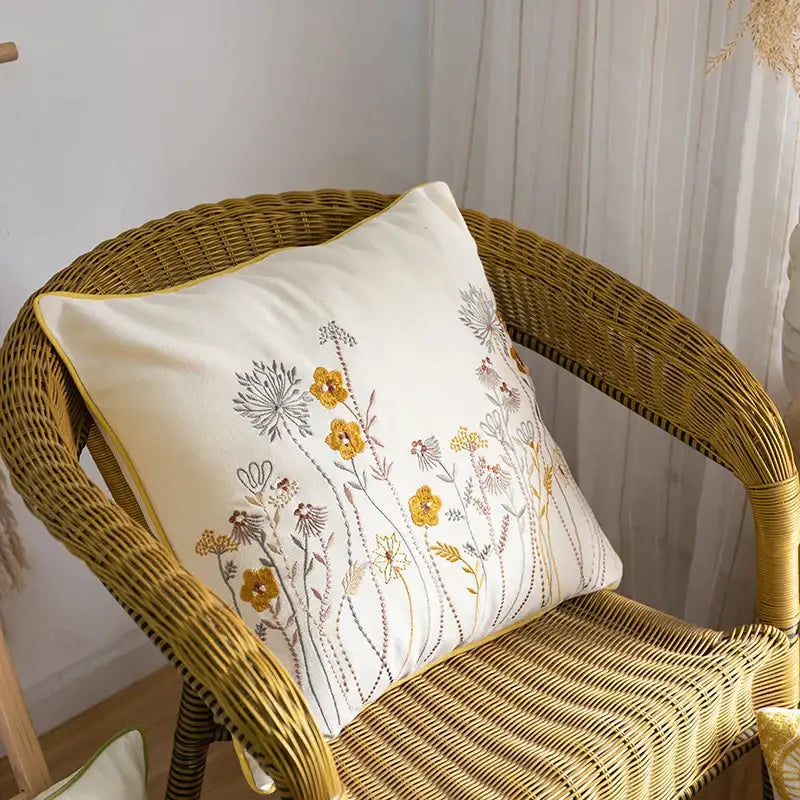 Cream-colored cotton linen pillowcase with delicate yellow gray and pink floral embroidery for bedroom decorbites decor