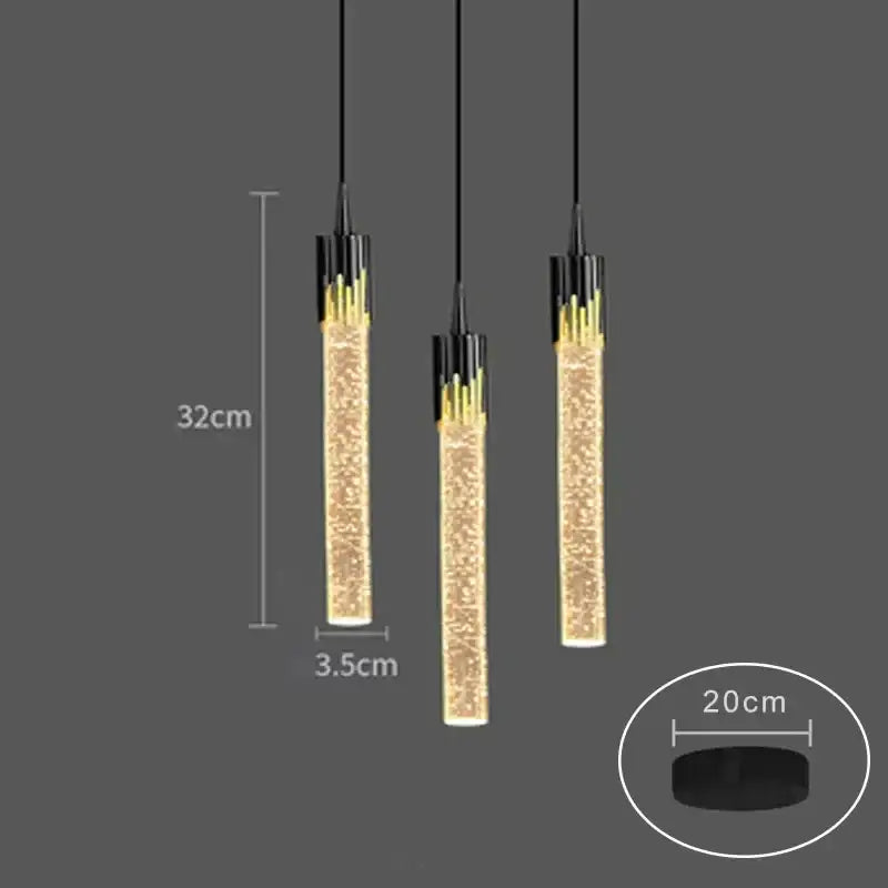Modern black and gold pendant light with crystal rod design and sparkling golden glass interior for dining room use