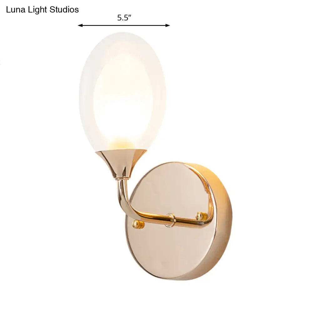 DecorBites™ DecorBites™ Modern Brass Wall Sconce with Clear Glass Shade - Oval Design for Dining Room