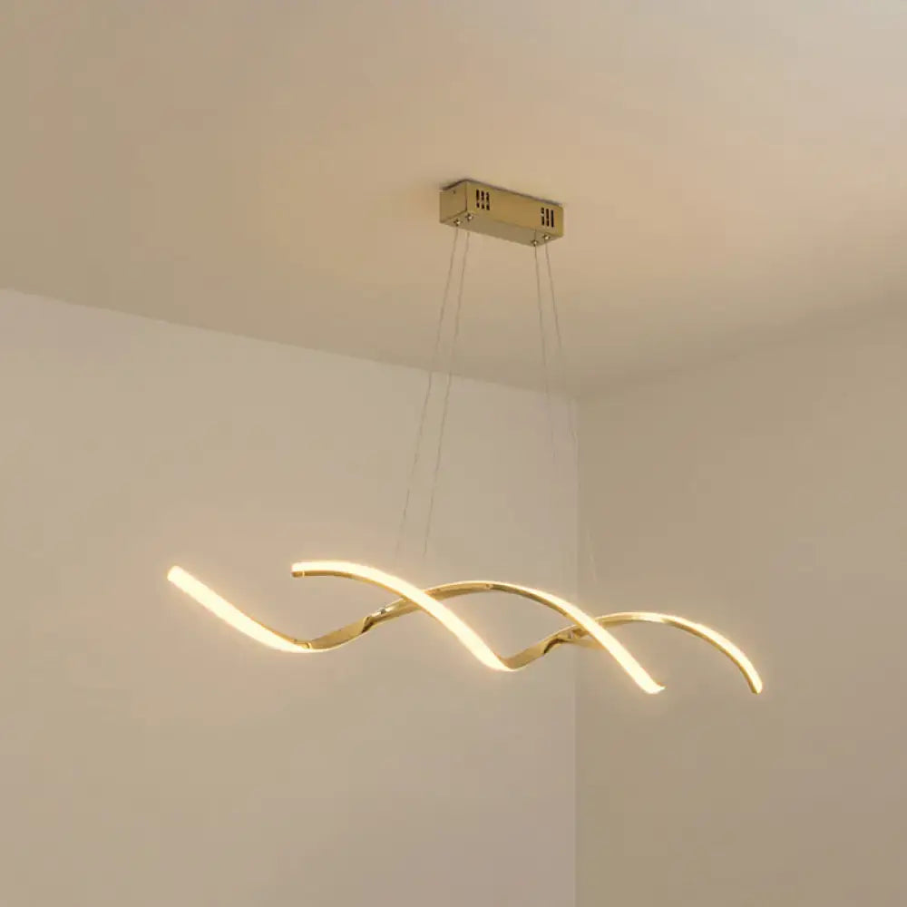Gold-toned modern led island lighting with three intertwined curved arms for sleek kitchen pendant lighting