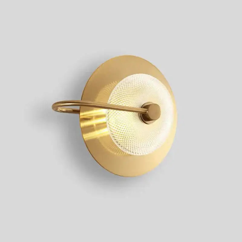 Modern circular green copper wall lamp with gold-toned brass base and textured frosted glass diffuser wall sconce decorbites circular green