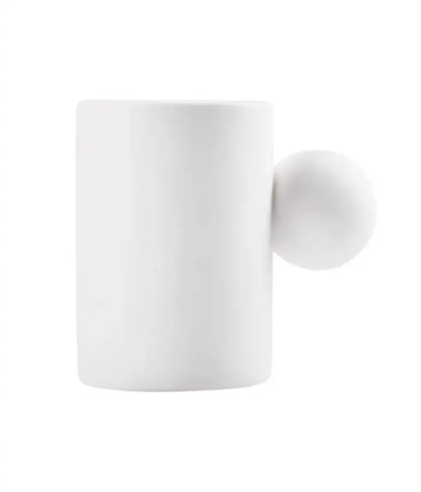 Modern cream ceramic cup and saucer set with white ceramic cup featuring a spherical handle decorbites cotton candy