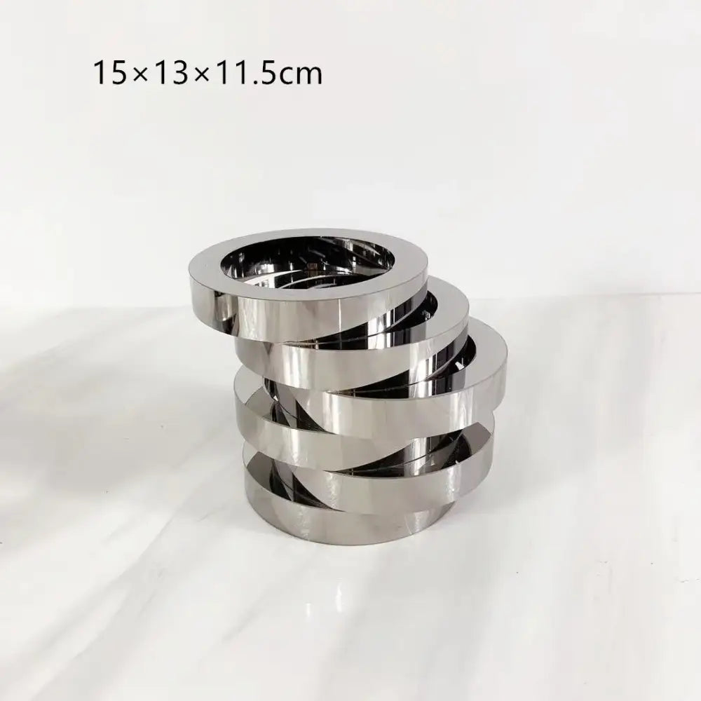 Stack of five interlocking silver metallic rings with geometric circle design for decorbites crystal glass geometric vase decor