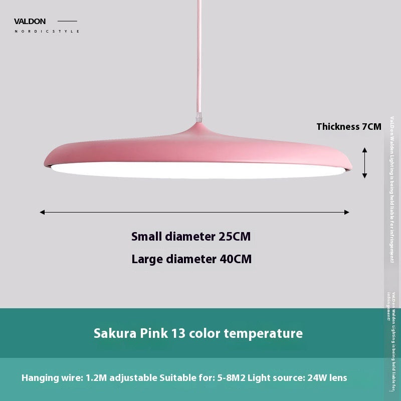 Sakura pink pendant light with a matte finish, 24w lens and adjustable hanging wire.