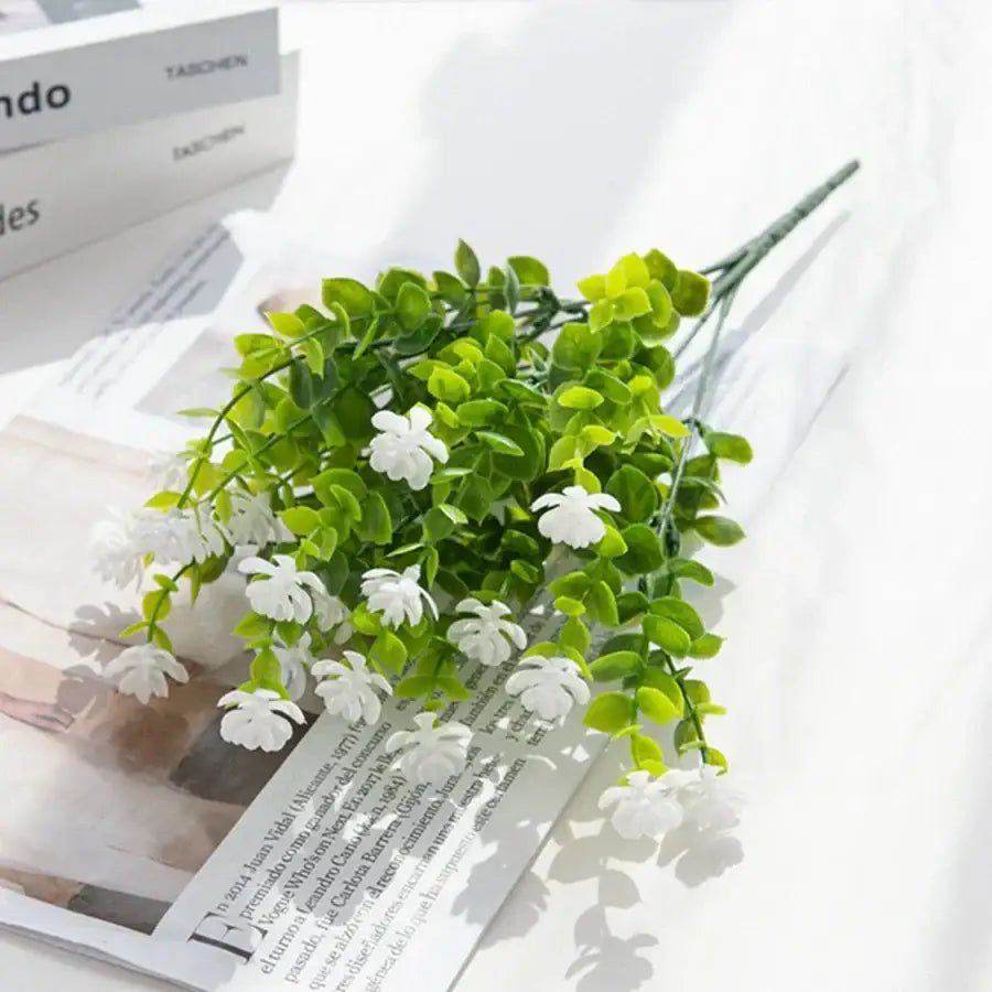 Purple artificial eucalyptus plant with white blossoms and green leaves made from synthetic materials for decorbites artificial eucalyptus decor