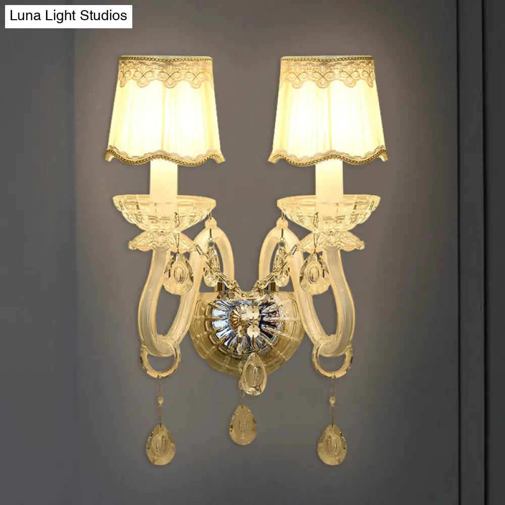 Traditional White Candle Wall Lamp with Clear Crystal Accent and Scalloped Fabric Shade