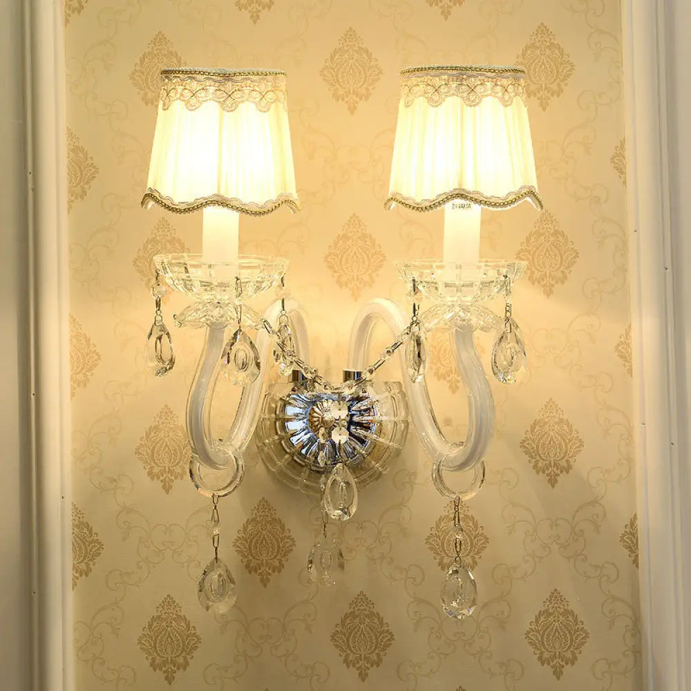Traditional White Candle Wall Lamp with Clear Crystal Accent and Scalloped Fabric Shade