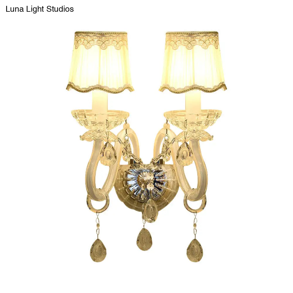 Traditional White Candle Wall Lamp with Clear Crystal Accent and Scalloped Fabric Shade