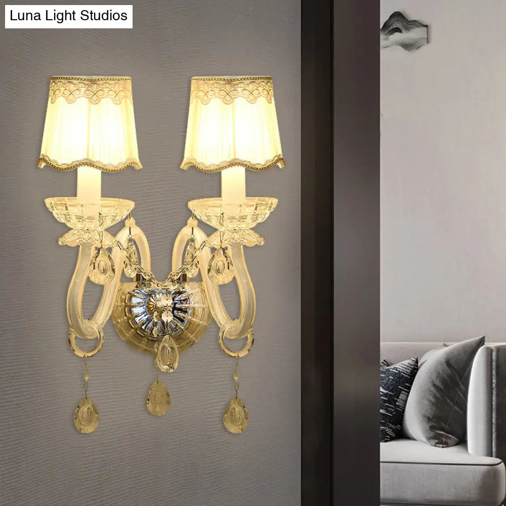 Traditional White Candle Wall Lamp with Clear Crystal Accent and Scalloped Fabric Shade