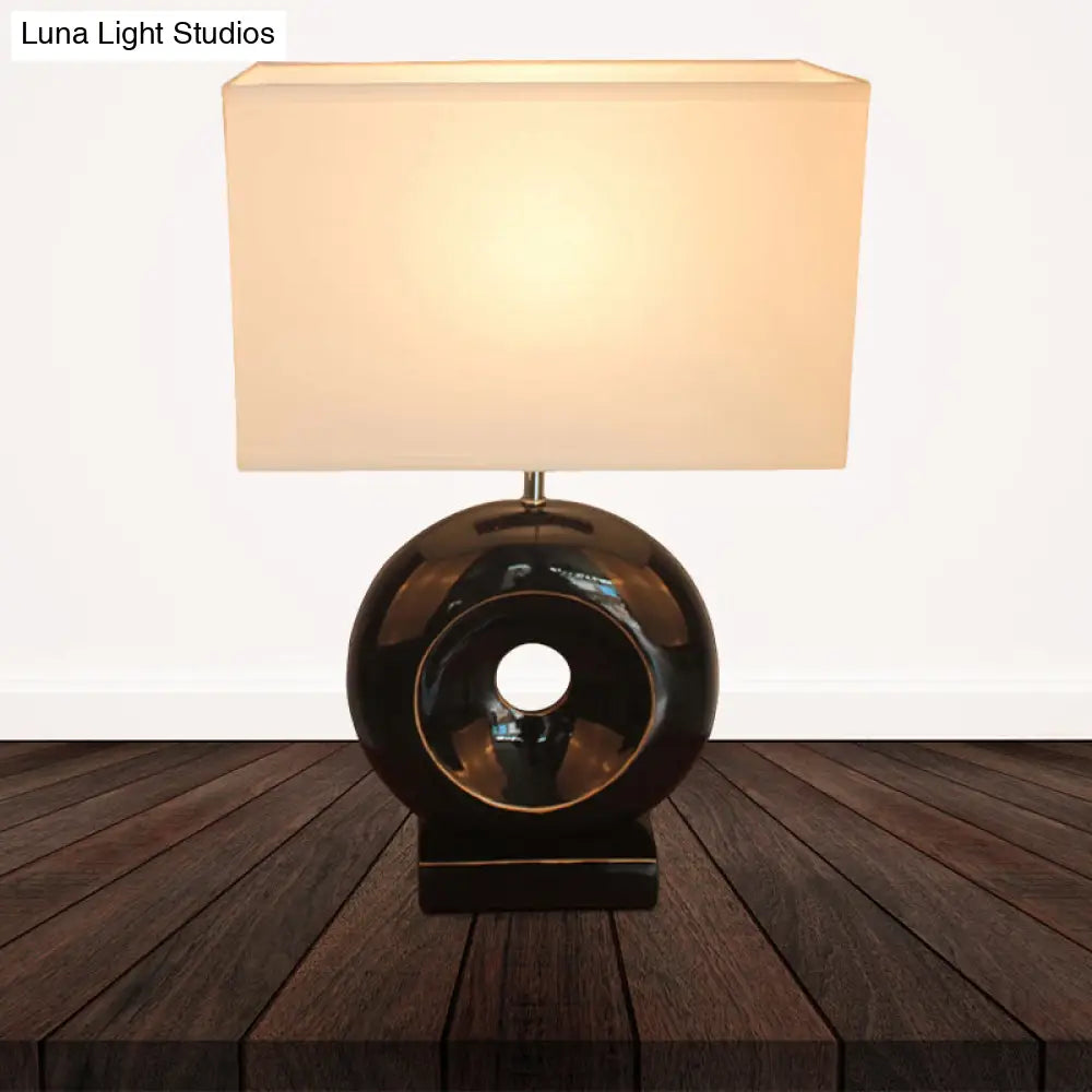 Transitional Resin Table Light with Silver/Black Finish, Rectangle/Drum Fabric Shade, and 1 Bulb