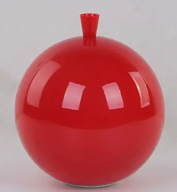 Vibrant red glossy ceramic pendant light with small cylindrical neck for childrens bedroom installation method visible