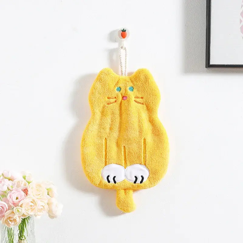 A bright yellow plush coral plush cat hand towel with embroidered blue eyes and pink nose for bathroom decorbites coral plush decor
