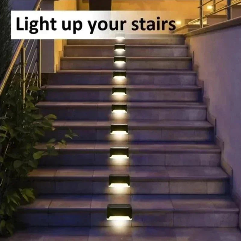 Black rectangular solar led step lights with warm white illumination for outdoor garden stairs safety and ambiance