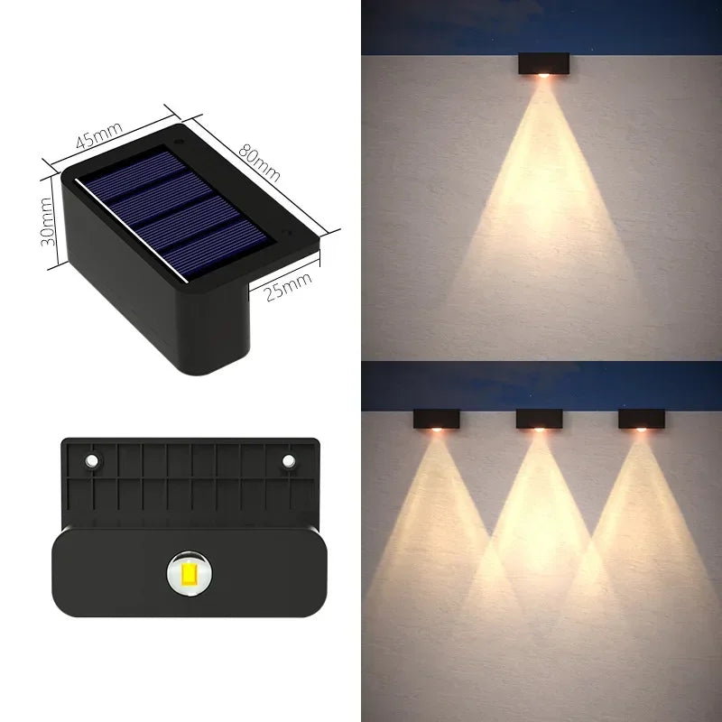 Black rectangular led solar wall light with ip65 waterproof rating warm white led and built-in motion sensor for outdoor use