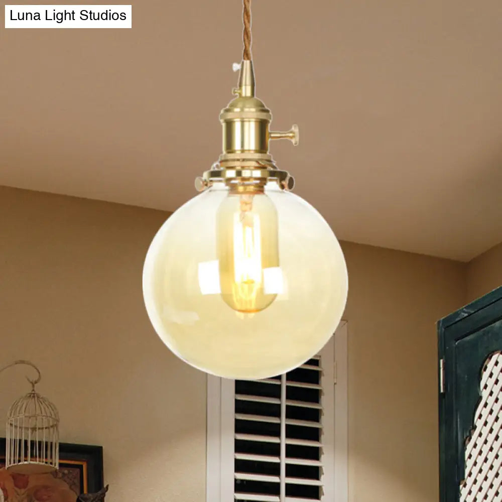 1-Light Amber Pendant Light with Adjustable Cord and Globe Glass Shade - Industrial Indoor Lighting