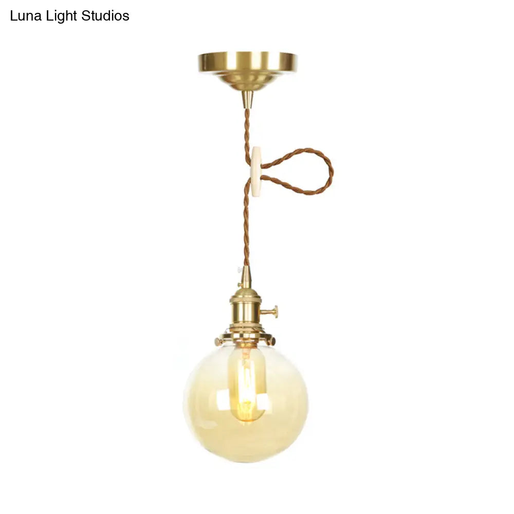 1-Light Amber Pendant Light with Adjustable Cord and Globe Glass Shade - Industrial Indoor Lighting