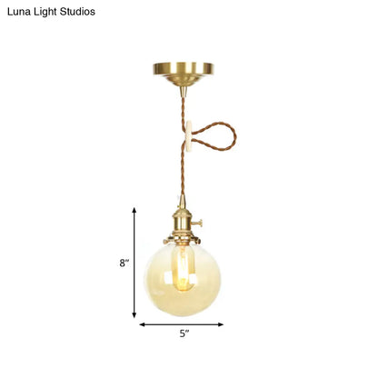 1-Light Amber Pendant Light with Adjustable Cord and Globe Glass Shade - Industrial Indoor Lighting