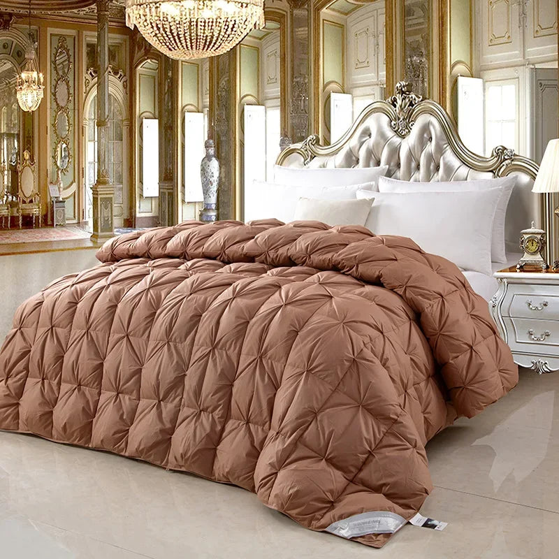 A plush taupe 100% white goose down comforter with diamond quilted pattern and pure cotton high quality design