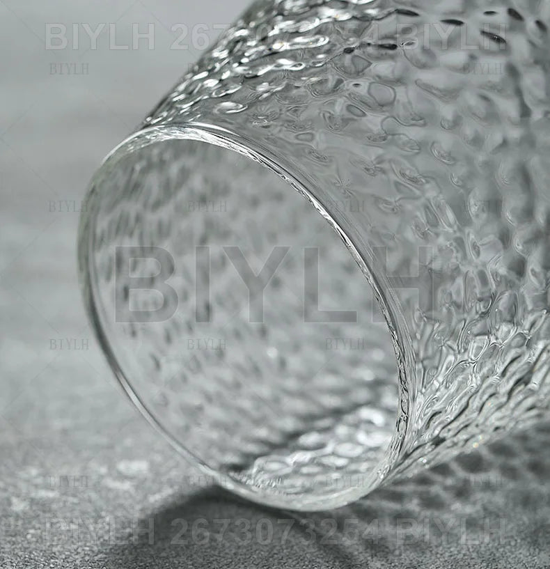 Clear glass tumbler with textured hammered surface included in transparent hydroponic glass flower pot set with base tray