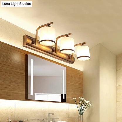Aplique de pared de 2/3 luces en color oro colonial con cristal blanco esmerilado: perfecto para la iluminación del baño.