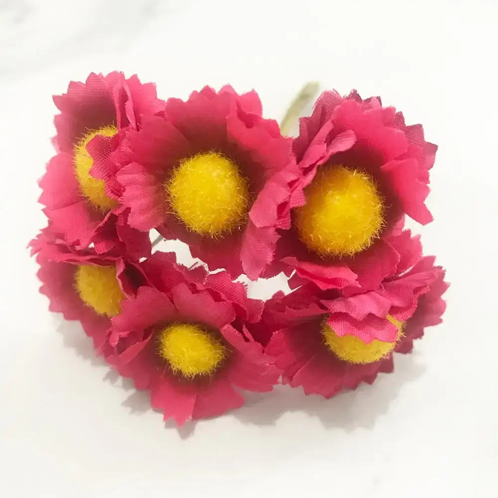 A cluster of vibrant pink artificial daisies with fuzzy yellow centers from a 200pcs mixed rose red flower stamen bundle for diy decor
