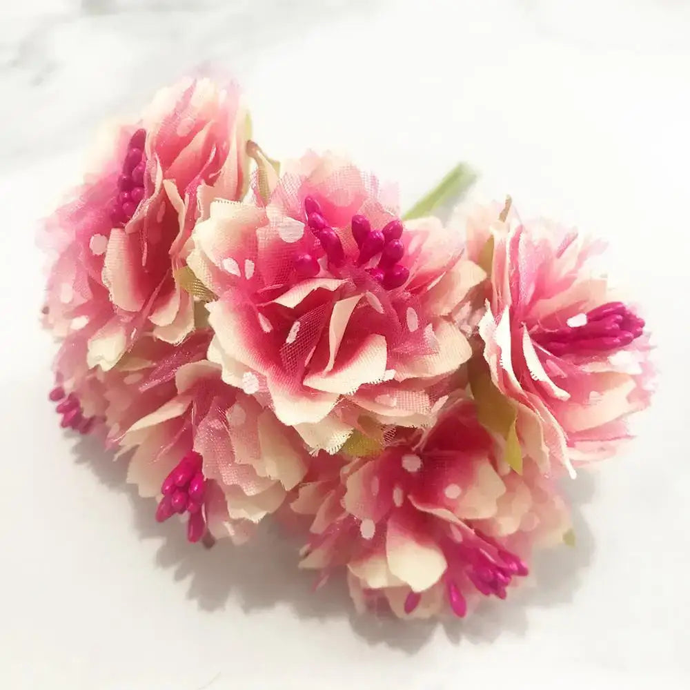 A cluster of 200pcs mixed rose red artificial flowers with layered petals and vibrant magenta centers for diy decor