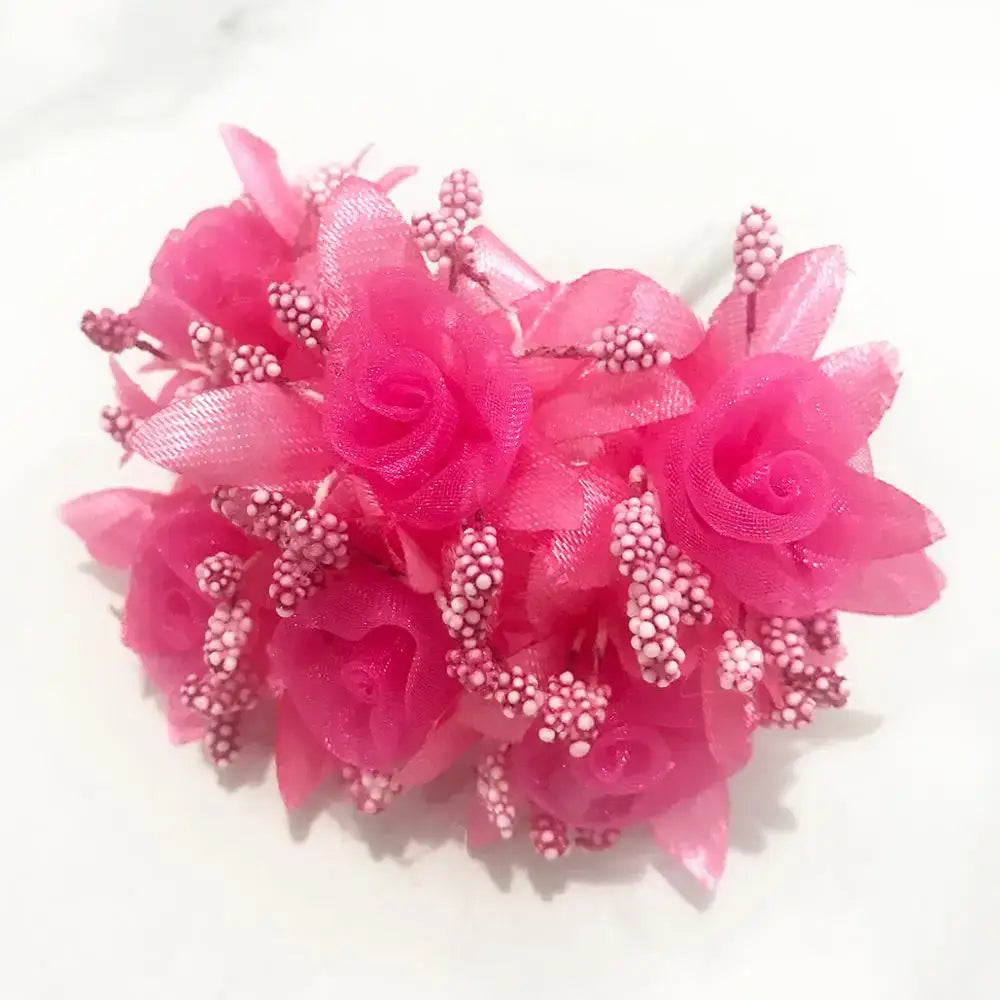 A cluster of vibrant pink fabric roses with delicate beaded stems in a 200pcs mixed rose red flower stamen bundle