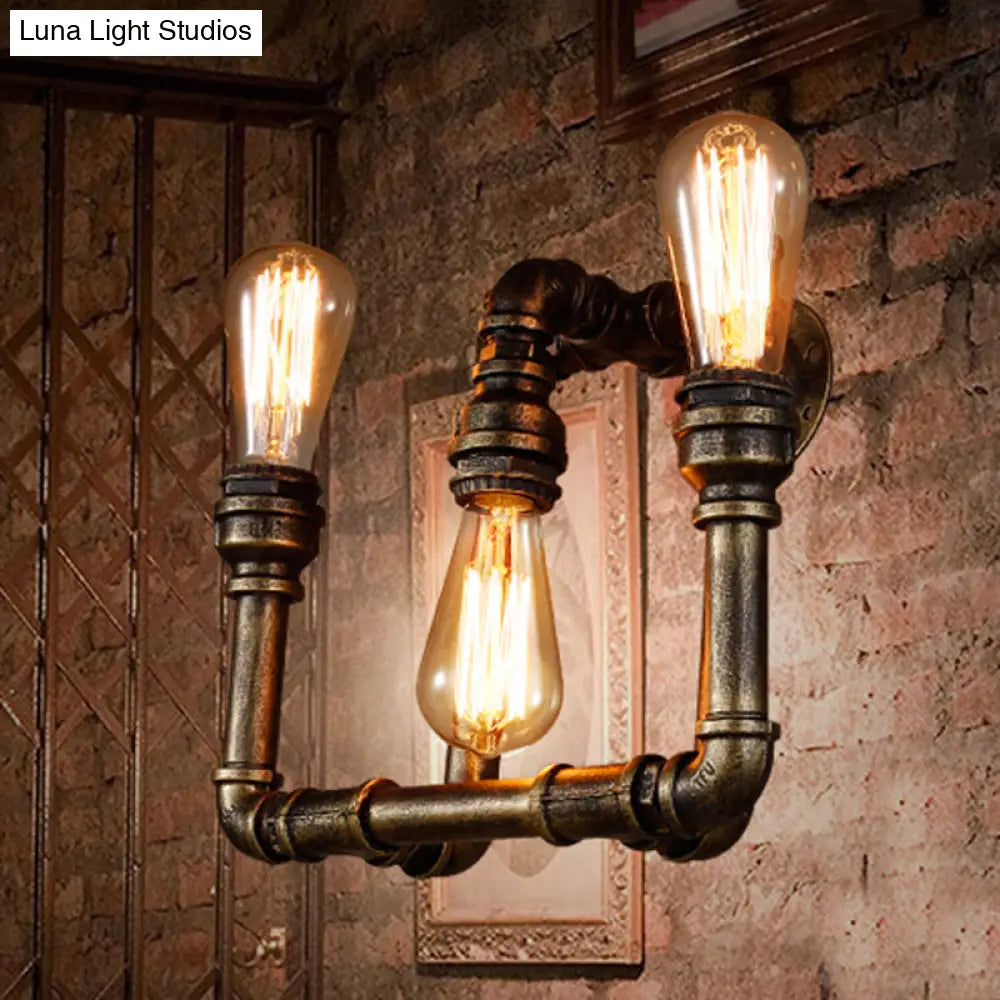 Aplique industrial de 3 luces con diseño de tubería de hierro forjado en latón envejecido para pasillo