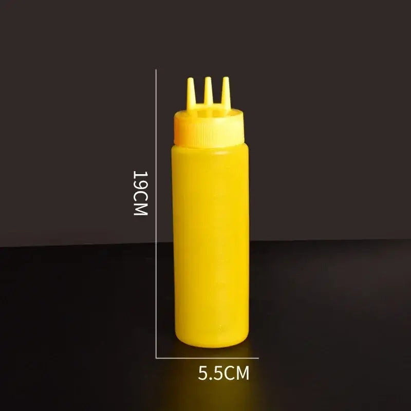 Yellow plastic squeeze bottle condiment dispenser with three nozzles cap for multi-color kitchen use