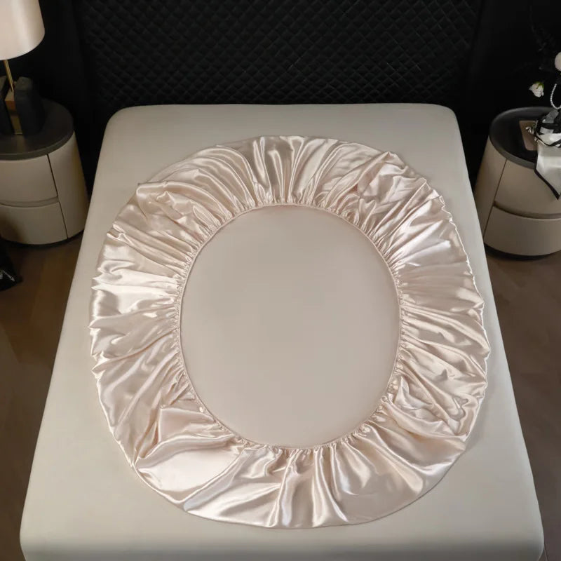 Delicate champagne satin-finish bed skirt with gathered ruffles in a 3 pcs high end 100% mulberry silk sheet set fitted sheet