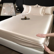 Cream-colored 3 pcs mulberry silk sheet set featuring a smooth satin fitted sheet with elasticized edges