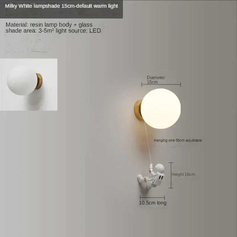 Milky white spherical resin and glass astronaut moon wall lamp mounted on gold wall fixture for kids bedroom decorbites astronaut moon