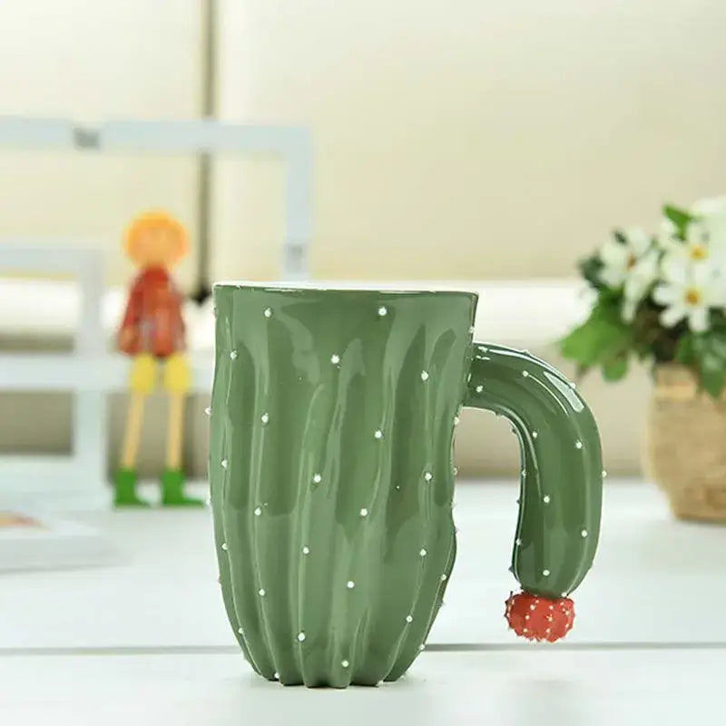 Green ceramic 3d cactus style ceramic mug with white polka dot details and red fruit accent handle by decorbites