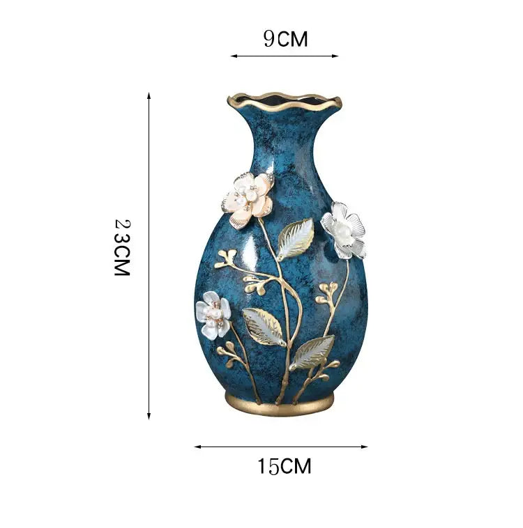 Blue ceramic vase with gold trim and raised white floral motifs designed for dried flowers and wobble plate use